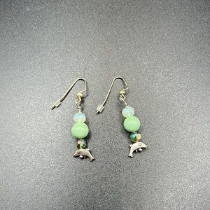 Dolphins with green beads